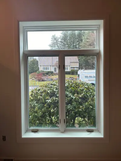 New Harvey casement windows with stained wood interior trim in Framingham, MA - photo 16