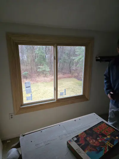 New Harvey casement windows with stained wood interior trim in Framingham, MA - photo 42