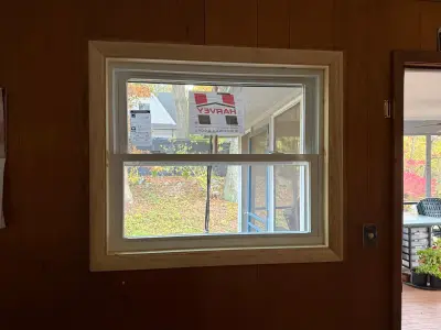 Rigid foam insulation board and new windows installed before siding on a ranch home - photo 24