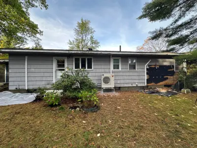 Rigid foam insulation board and new windows installed before siding on a ranch home - photo 37