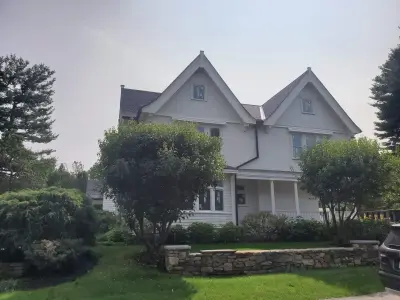 Warm white clapboard home with new windows and gray shingle roof in Wellesley, MA - photo 6