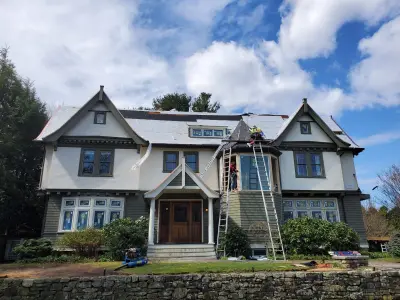 Warm white clapboard home with new windows and gray shingle roof in Wellesley, MA - photo 22