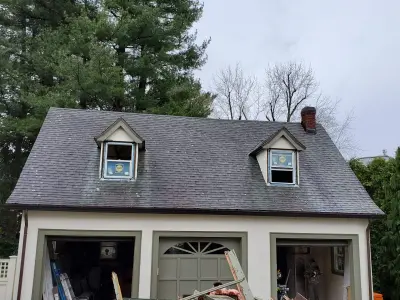 Warm white clapboard home with new windows and gray shingle roof in Wellesley, MA - photo 25