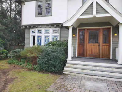 Warm white clapboard home with new windows and gray shingle roof in Wellesley, MA - photo 33