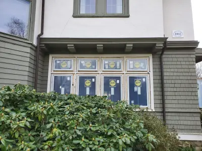 Warm white clapboard home with new windows and gray shingle roof in Wellesley, MA - photo 34