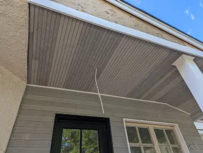 Light greige lap siding installation with black windows in Wellesley, MA - photo 4