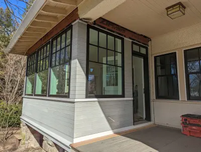 Light greige lap siding installation with black windows in Wellesley, MA - photo 6