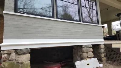 Light greige lap siding installation with black windows in Wellesley, MA - photo 10