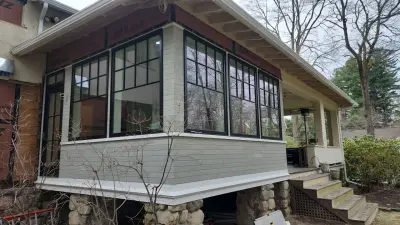 Light greige lap siding installation with black windows in Wellesley, MA - photo 11
