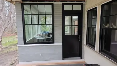 Light greige lap siding installation with black windows in Wellesley, MA - photo 13