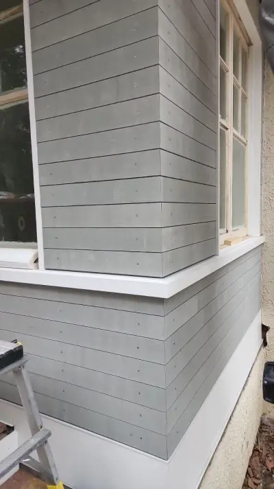 Light greige lap siding installation with black windows in Wellesley, MA - photo 15