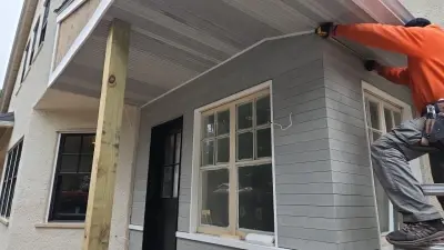 Light greige lap siding installation with black windows in Wellesley, MA - photo 16
