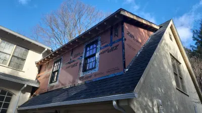 Light greige lap siding installation with black windows in Wellesley, MA - photo 18