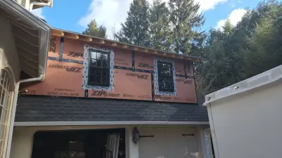 Light greige lap siding installation with black windows in Wellesley, MA - photo 19