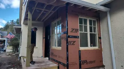 Light greige lap siding installation with black windows in Wellesley, MA - photo 21