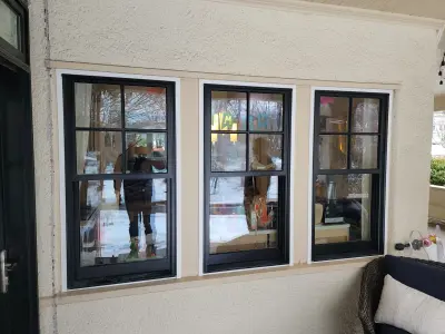 Light greige lap siding installation with black windows in Wellesley, MA - photo 23