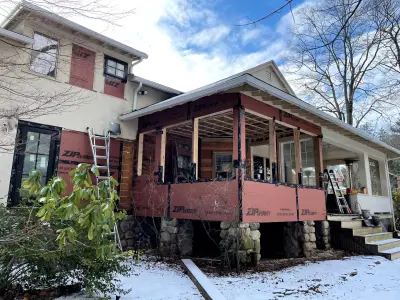 Light greige lap siding installation with black windows in Wellesley, MA - photo 32