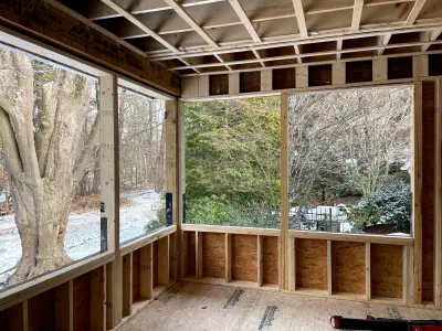 Light greige lap siding installation with black windows in Wellesley, MA - photo 35