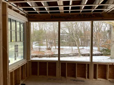 Light greige lap siding installation with black windows in Wellesley, MA - photo 37