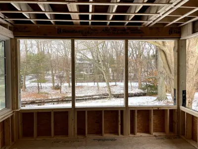 Light greige lap siding installation with black windows in Wellesley, MA - photo 38