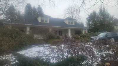 Light greige lap siding installation with black windows in Wellesley, MA - photo 40