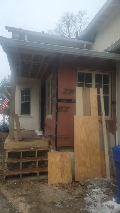 Light greige lap siding installation with black windows in Wellesley, MA - photo 46