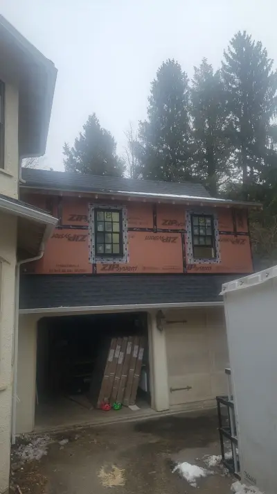Light greige lap siding installation with black windows in Wellesley, MA - photo 47