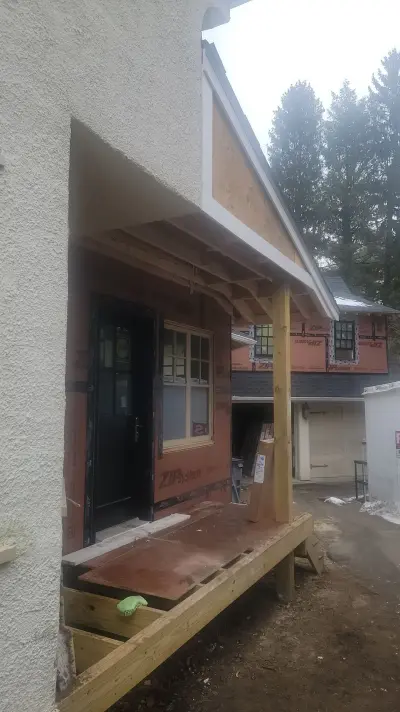 Light greige lap siding installation with black windows in Wellesley, MA - photo 48