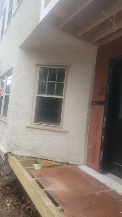 Light greige lap siding installation with black windows in Wellesley, MA - photo 49