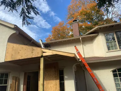 Light greige lap siding installation with black windows in Wellesley, MA - photo 53