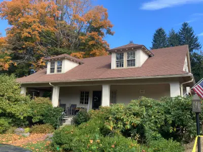 Light greige lap siding installation with black windows in Wellesley, MA - photo 55