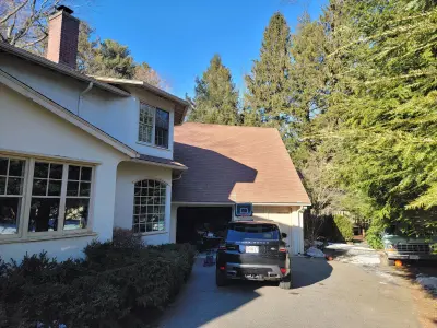 Light greige lap siding installation with black windows in Wellesley, MA - photo 59