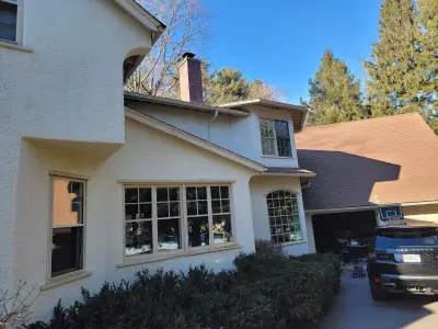 Light greige lap siding installation with black windows in Wellesley, MA - photo 60