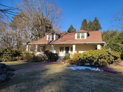 Light greige lap siding installation with black windows in Wellesley, MA - photo 62